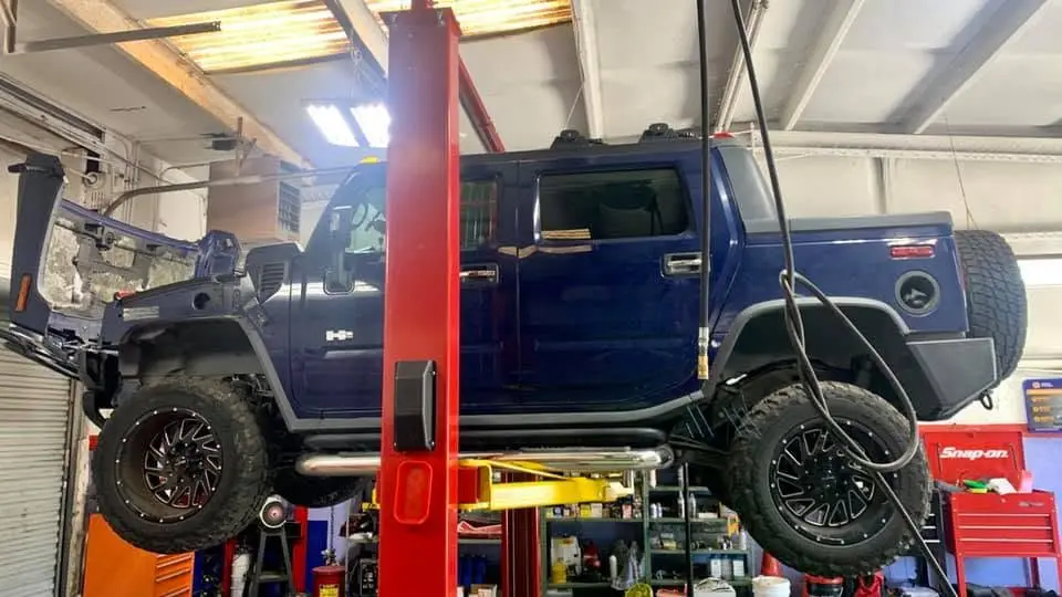 Hummer H2 on a lift at iShop